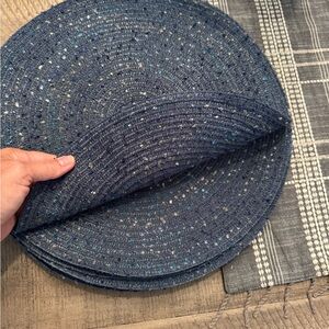 8 dark blue placemats. Good condition.